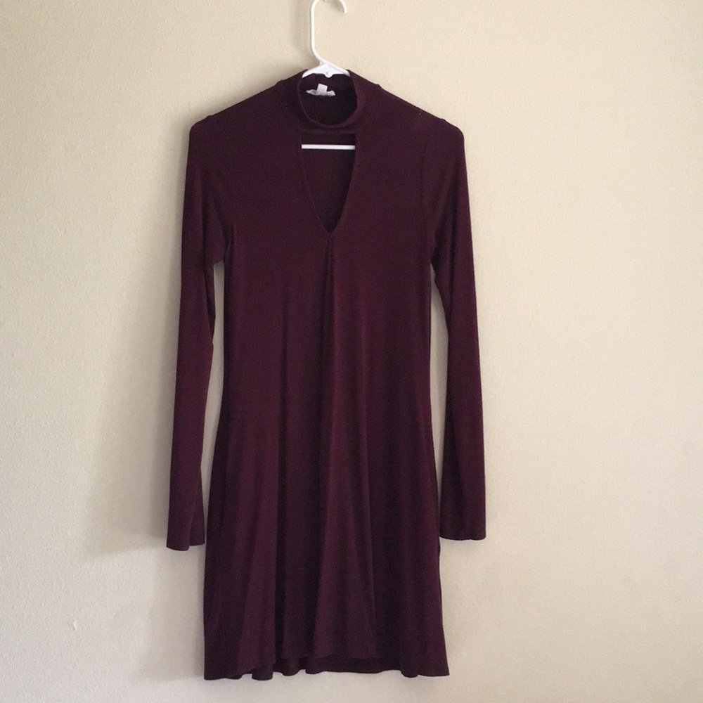maroon long sleeved dress with triangle cut out